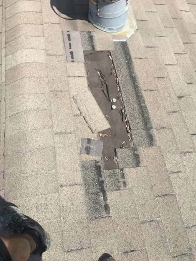 Active roof repair project on a large multi-family flat roof deck in Austin